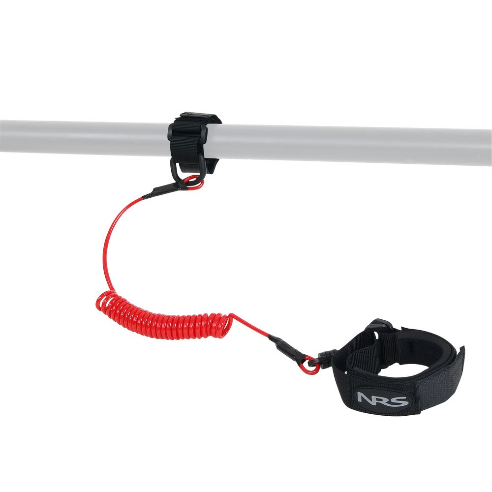 The NRS Paddle Leash is red and coiled, featuring a snap swivel for secure connection to a gray pole and a black wrist strap on the other end.