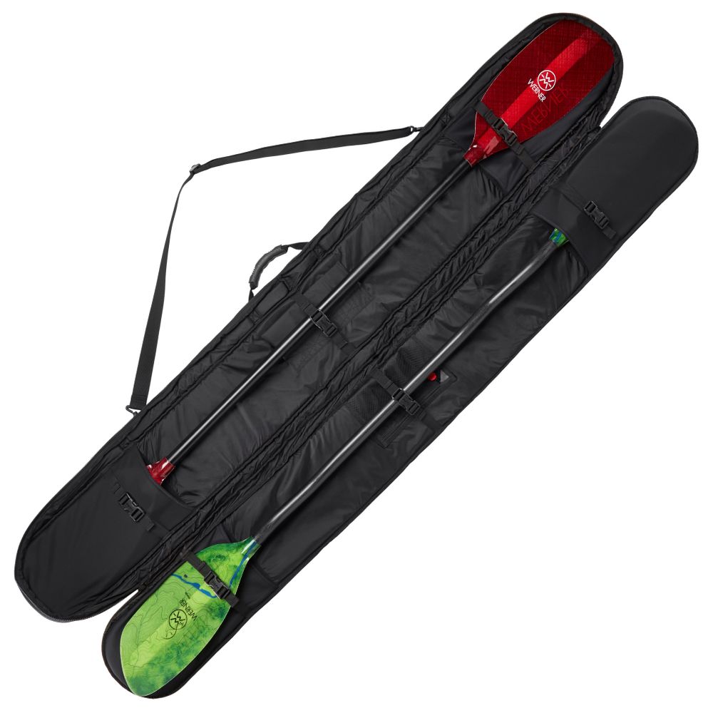 Two kayak paddles, red and green, rest inside an open NRS SUP/Whitewater Paddle Bag with a shoulder strap. The black bag features a padded fleece liner to cushion each paddle securely for transport.