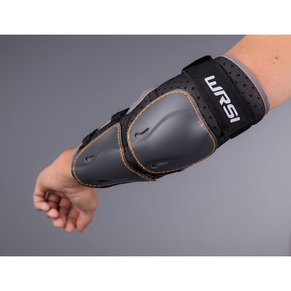 A gray elbow and forearm pad featuring black straps and the WRSI logo offers premium protection for paddlers. Made with ABS plastic armor, this NRS product ensures safety and durability on any adventure.