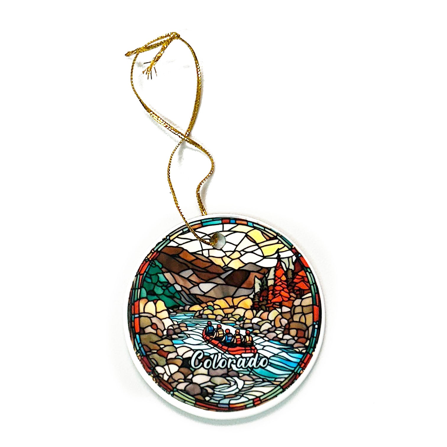 Round "Rafting Ornament" by Coyote, showcasing a colorful mosaic-style design of a river and mountains with "Colorado" text, complete with a gold hanging string.