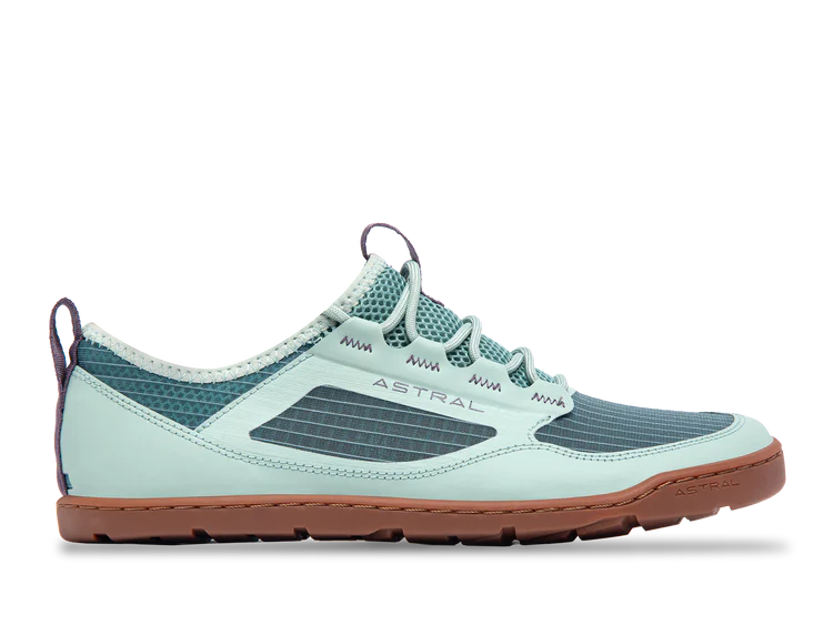 The men's Astral Loyak AC sneaker features a light blue and teal design with a brown sole, ripstop mesh upper, and white laces. G-Rubber outsoles enhance grip, while the "ASTRAL" branding on the side emphasizes its chic style.