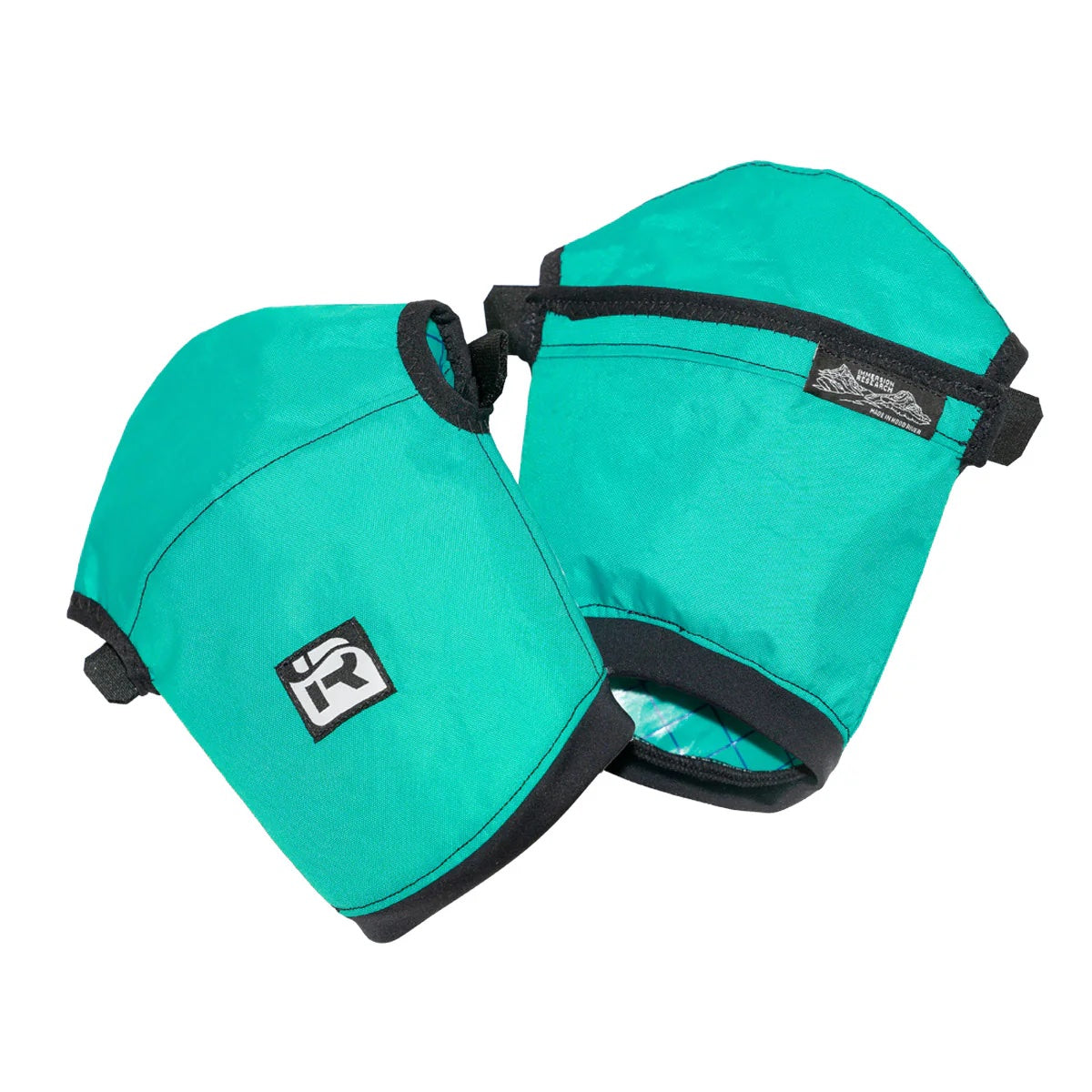 Two teal kayak spray skirts with black trim and a front logo, made from recycled polyester by Immersion Research, are displayed against a white background, ideal for cold-weather adventures.