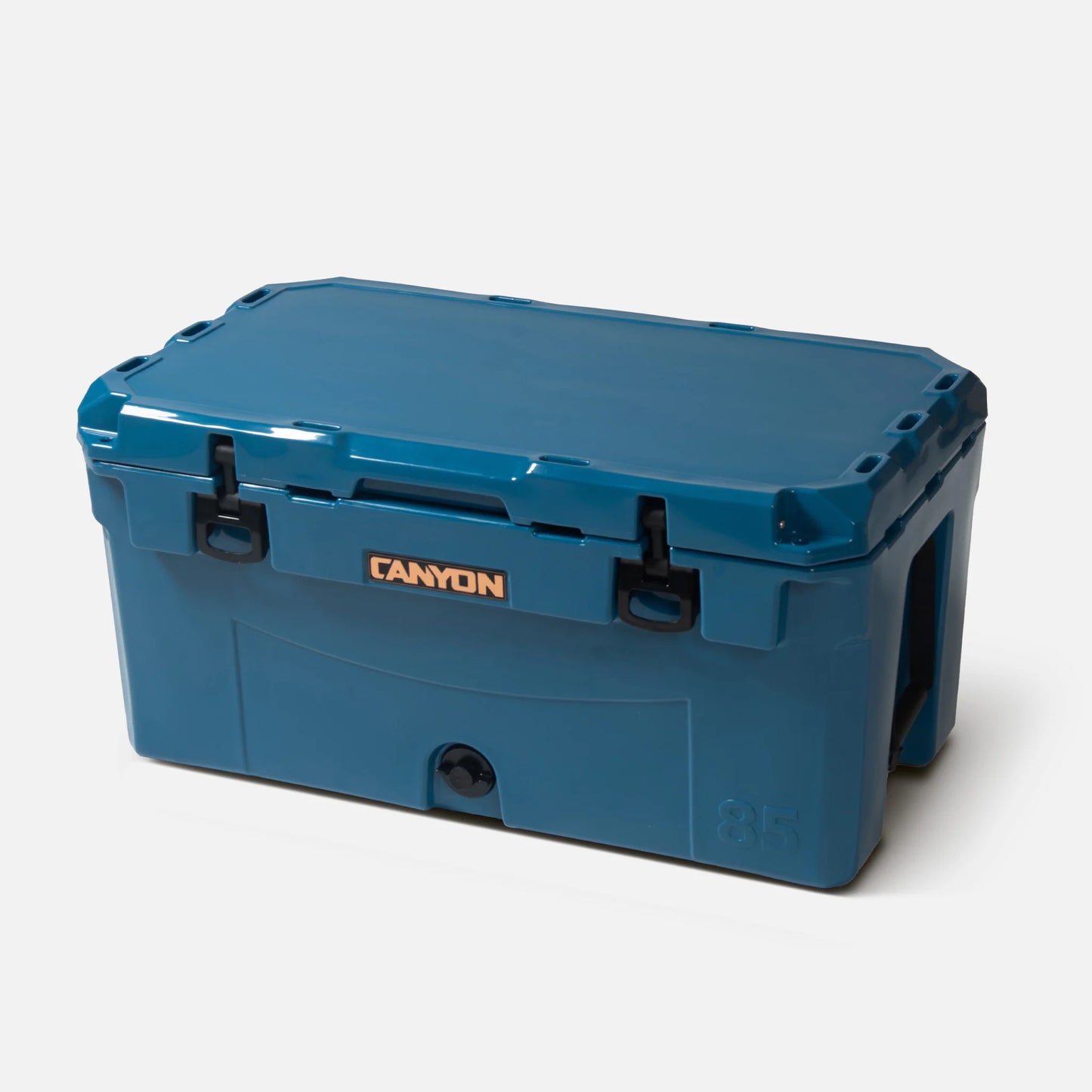 The PRO 85 Raft Cooler by Canyon Coolers is a large blue cooler with exceptional ice retention, featuring black latches, a sturdy handle, and prominent "Canyon Coolers" branding on the front.