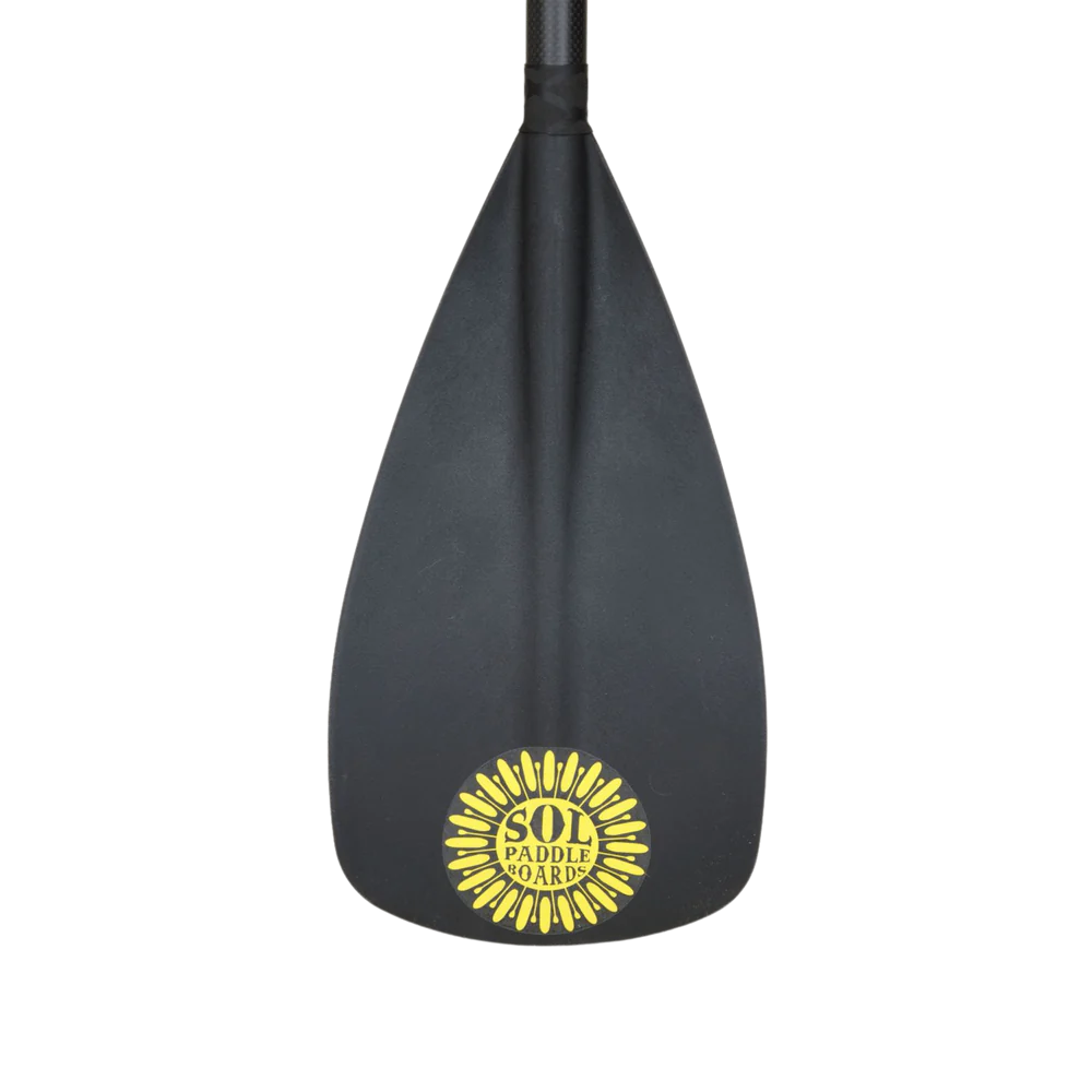 Close-up image of the Carbon Blaster 3-Piece Travel SUP Paddle's black carbon blade featuring the yellow SOL logo at the bottom.