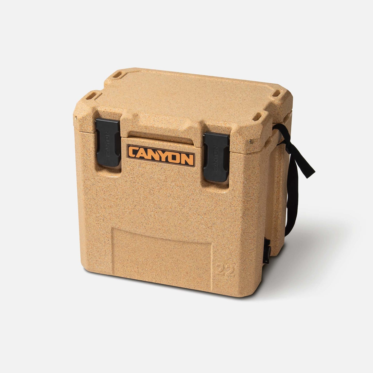 A tan-colored Canyon Outfitter 22 V2 Cooler with black latches and a carrying handle is shown against a plain white background, showcasing its durable rotomolded construction and Lifetime Warranty.