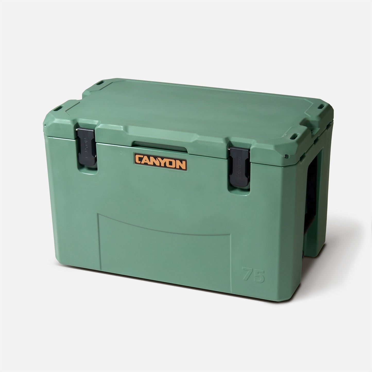 A large green Outfitter V2 Series Cooler by Canyon Coolers has two black latches, a gold logo, and is made from premium sun-resistant polymer with a dual-action drain for convenience.