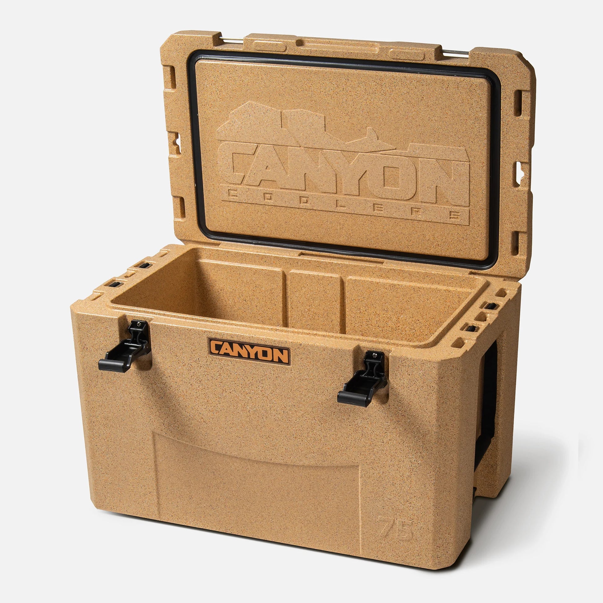 A tan Outfitter V2 Series Cooler by Canyon Coolers, with an open lid, black latches, and rugged design, is made from sun-resistant polymer and has a dual-action drain for convenience and durability.