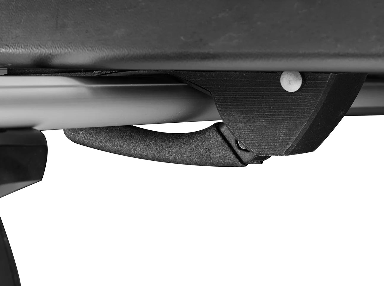 Close-up of a vehicle's cargo rack connector showcasing the sturdy bracket and curved supportive arm, perfect for securing your Yakima Skybox NX XXL. Ideal for travel enthusiasts needing reliable storage solutions.