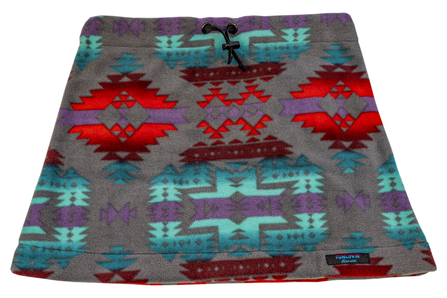 The FunLuvin' Fleece Skirt by FunLuvin' Fleecewear showcases a tribal geometric pattern in red, turquoise, and purple on a gray background. It features a comfortable elastic waistband and is crafted from anti-pill fleece for lasting wear.