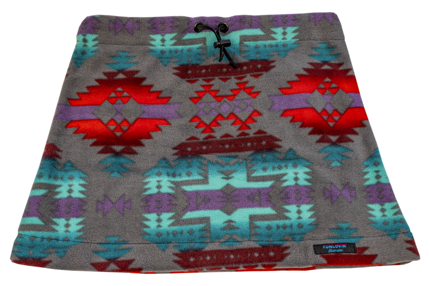 The FunLuvin' Fleece Skirt by FunLuvin' Fleecewear showcases a tribal geometric pattern in red, turquoise, and purple on a gray background. It features a comfortable elastic waistband and is crafted from anti-pill fleece for lasting wear.