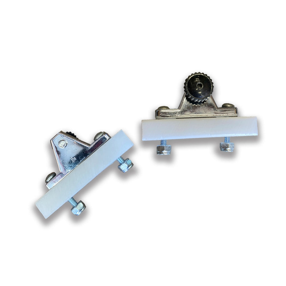 The Bimini Fixed Mount by Coyote River Gear features two metallic clips with white bases and screws, ideal for securing deck mounts, displayed on a plain white background.