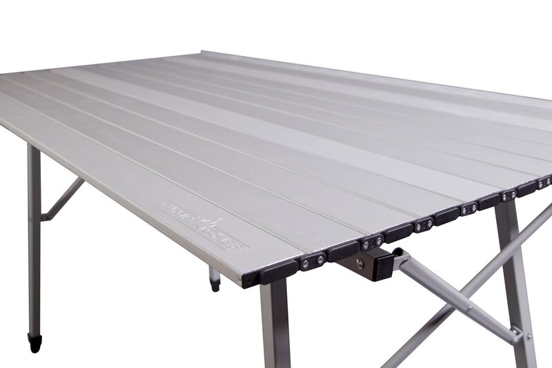 A Camp Chef Mesa Adjustable Camp Table with a folding top, perfect for outdoor gatherings.