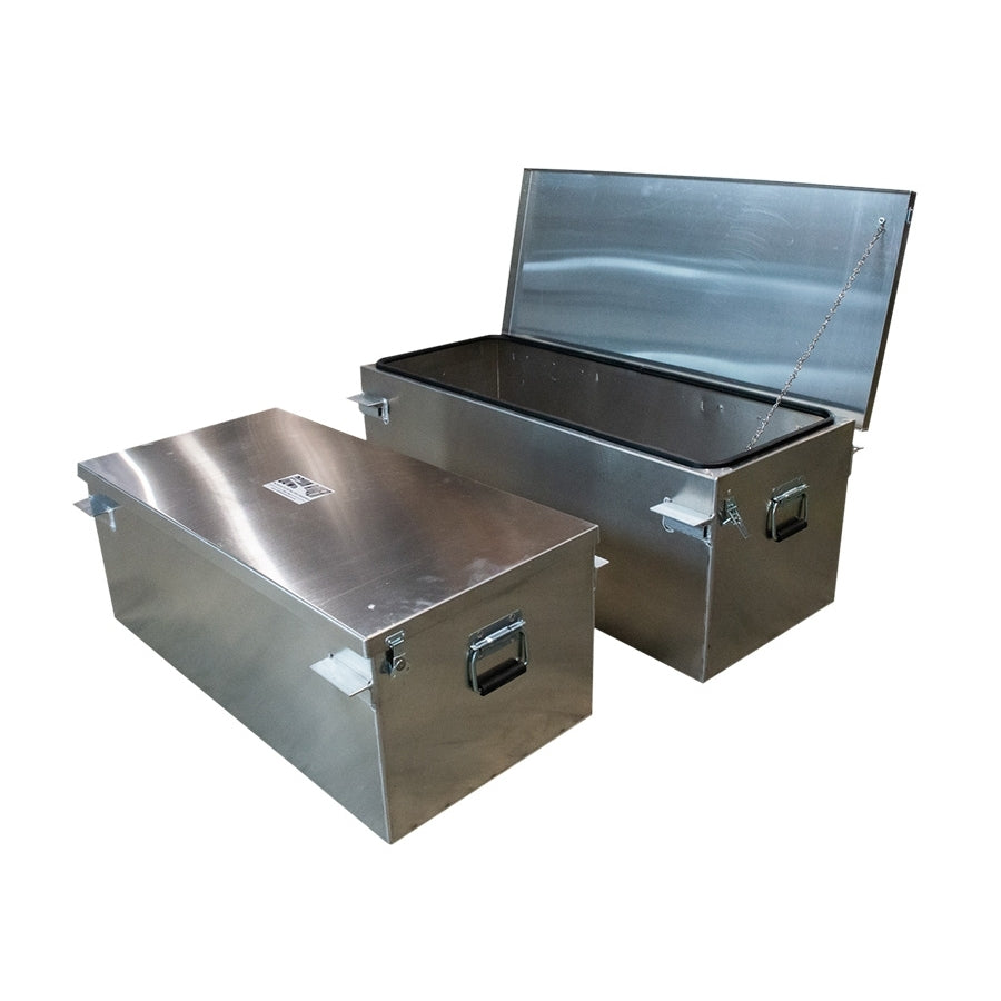 Two Gunnison Dryboxes by Down River Equipment, made from aircraft-grade aluminum, are shown: one with a lid ajar. Both feature secure handles, latches, and rubber gaskets for watertight sealing.