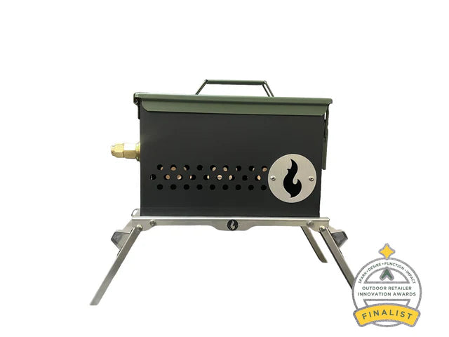 The Original LavaBox Combo by LavaBox features a portable propane fire box adorned with a flame logo and side ventilation holes, supported on metal legs. An "Outdoor Retailer Innovation Awards Finalist" badge in the bottom right celebrates its innovative design.