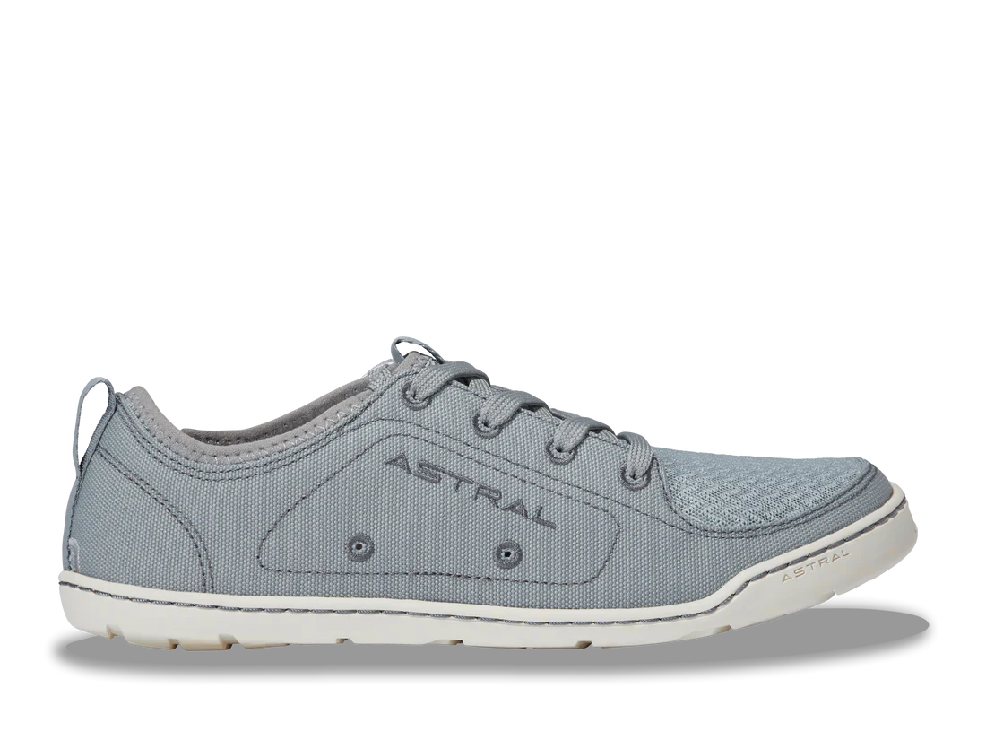 The Loyak - Women's sneaker by Astral, perfect for kayaking, features "ASTRAL" on the side. It has textured fabric, a lace-up design, and a white FlexGrip sole. Left side view.