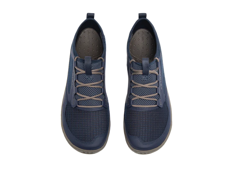 The Loyak AC by Astral is a pair of men's sneakers in navy blue with beige laces, featuring a textured ripstop mesh design and a sturdy sole equipped with sticky G-Rubber outsoles, shown from an overhead view.