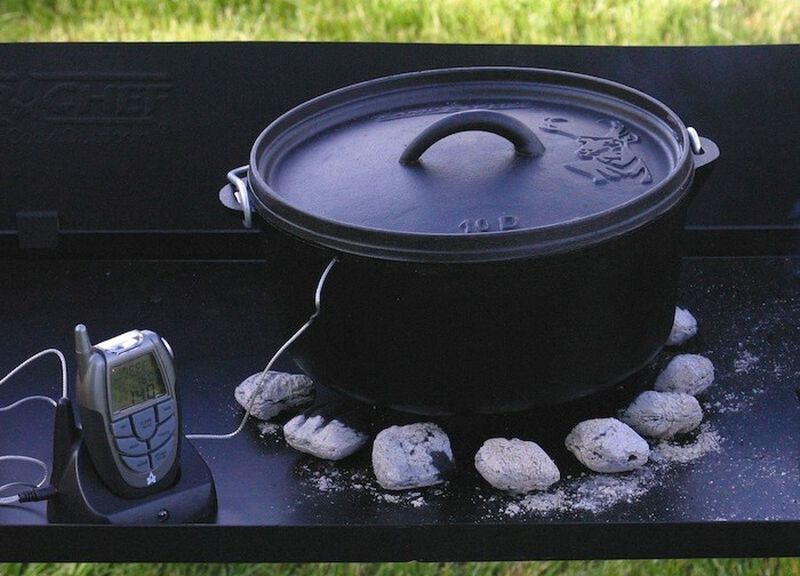 A pot on a grill with a Camp Chef Wireless Cooking Thermometer on it.