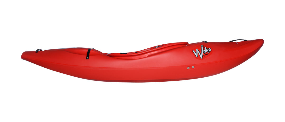 The Waka OG is a red plastic kayak with a curved, streamlined design, featuring the brand name 'Waka' on the side. This maneuverable kayak offers exceptional ease of control and stability on the water.