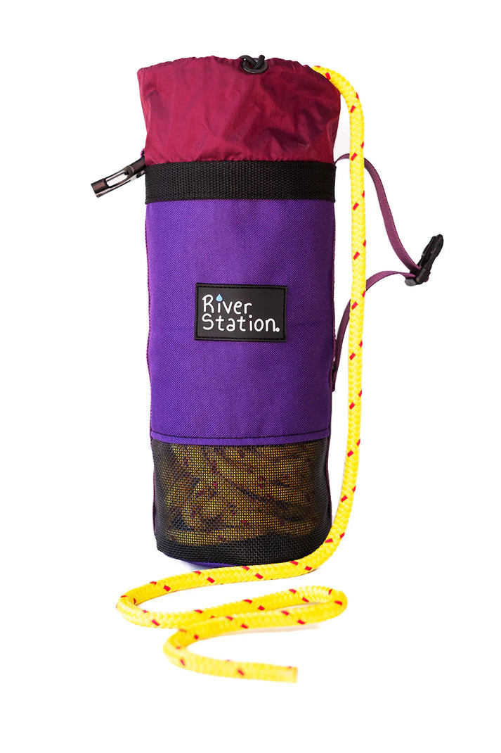 A River Station Gear branded The B.O.A.T. - Classic Rescue Throw Bag - 70ft with a yellow floating rescue rope attached.