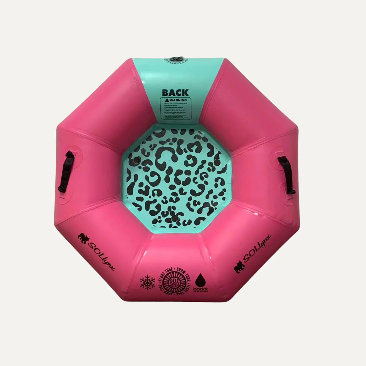 Ride the slopes with SOL Paddle Boards' SOLtube, a pink and turquoise octagonal inflatable snow tube. Featuring a leopard print center, sturdy black handles, welded seam technology, and extra thick PVC for ultimate durability and fun.