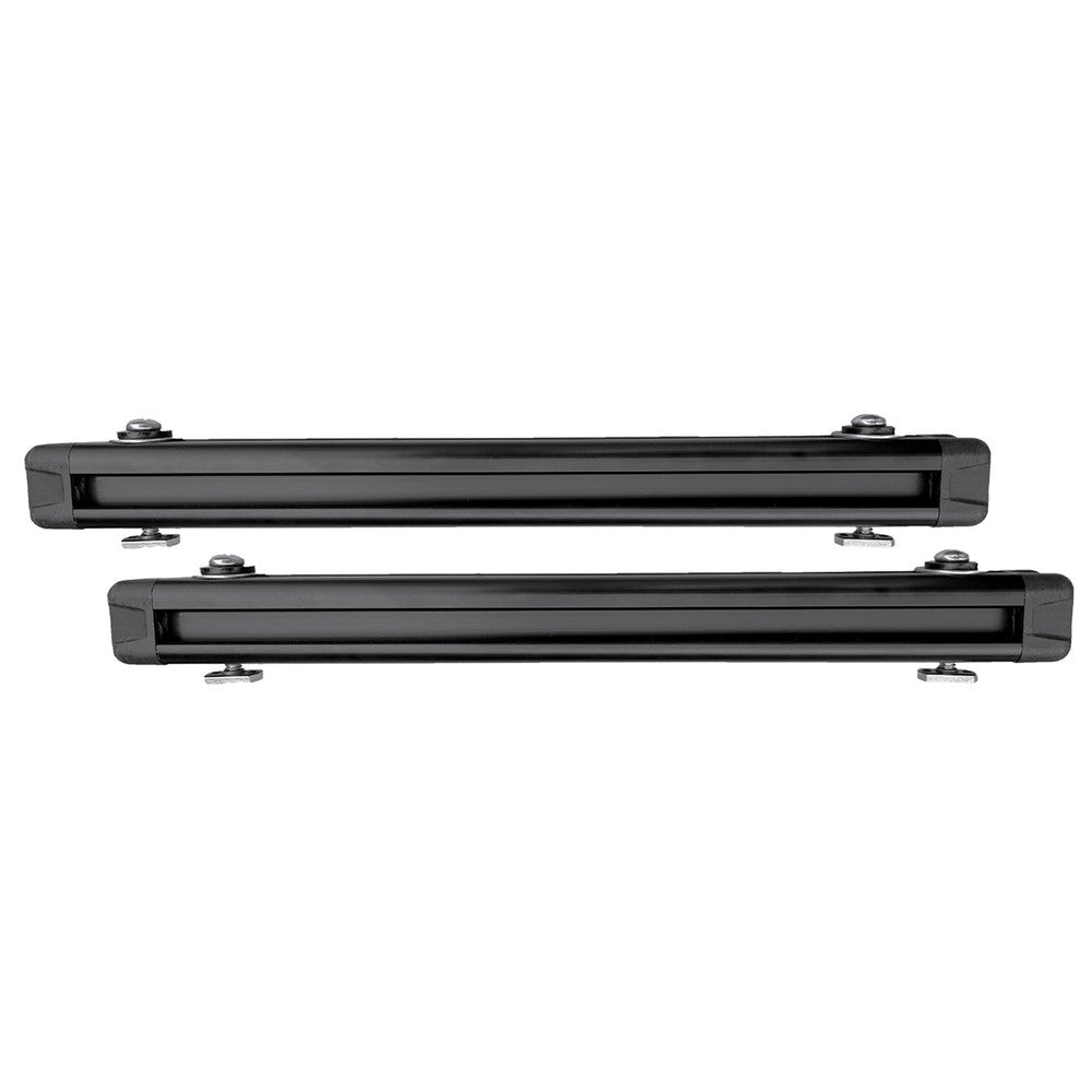 Two black rectangular roof rack crossbars from the Jackson Kayak TriTrak Kit, featuring YakAttack technology and mounting hardware on each end, shown side by side against a white background.